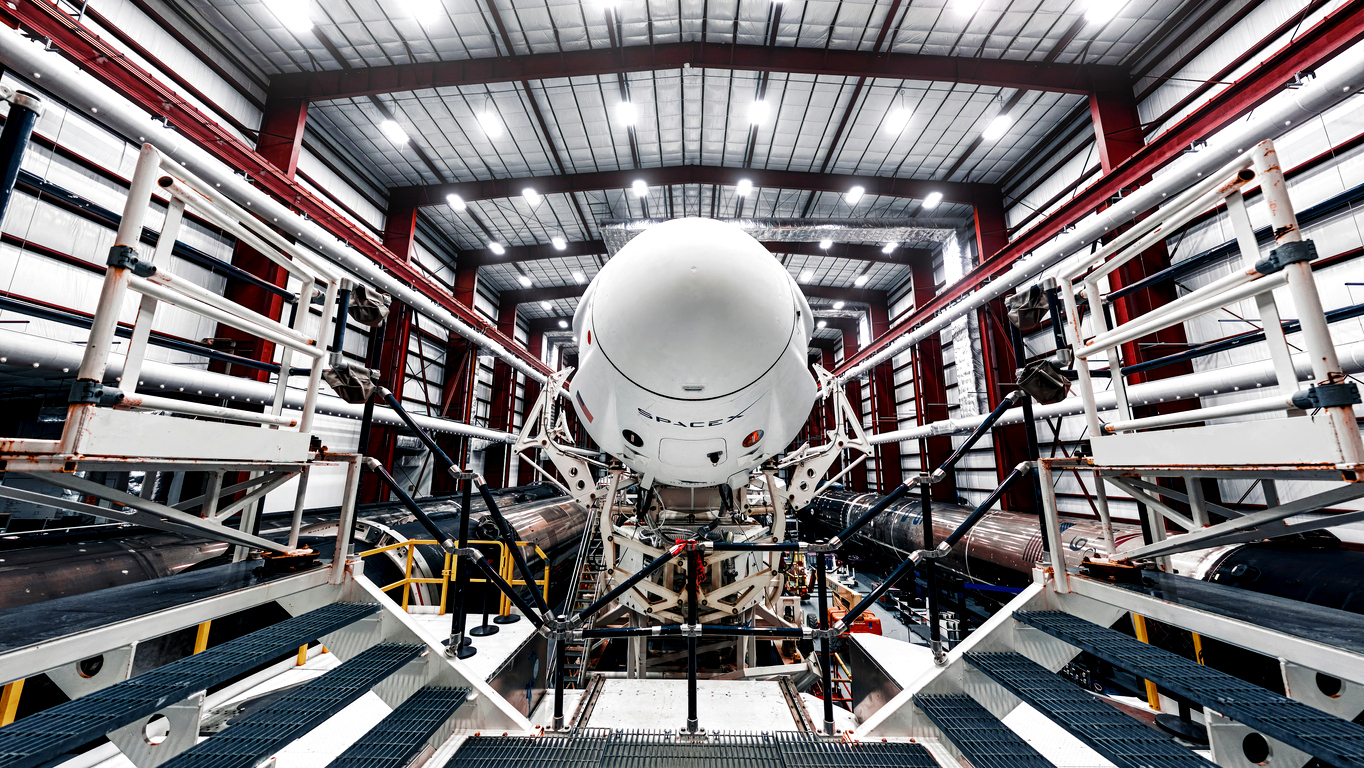 Space launch preparation. Spaceship SpaceX Crew Dragon, atop the Falcon 9 rocket, inside the hangar , just before rollout to the launchpad. Elements of this image furnished by NASA